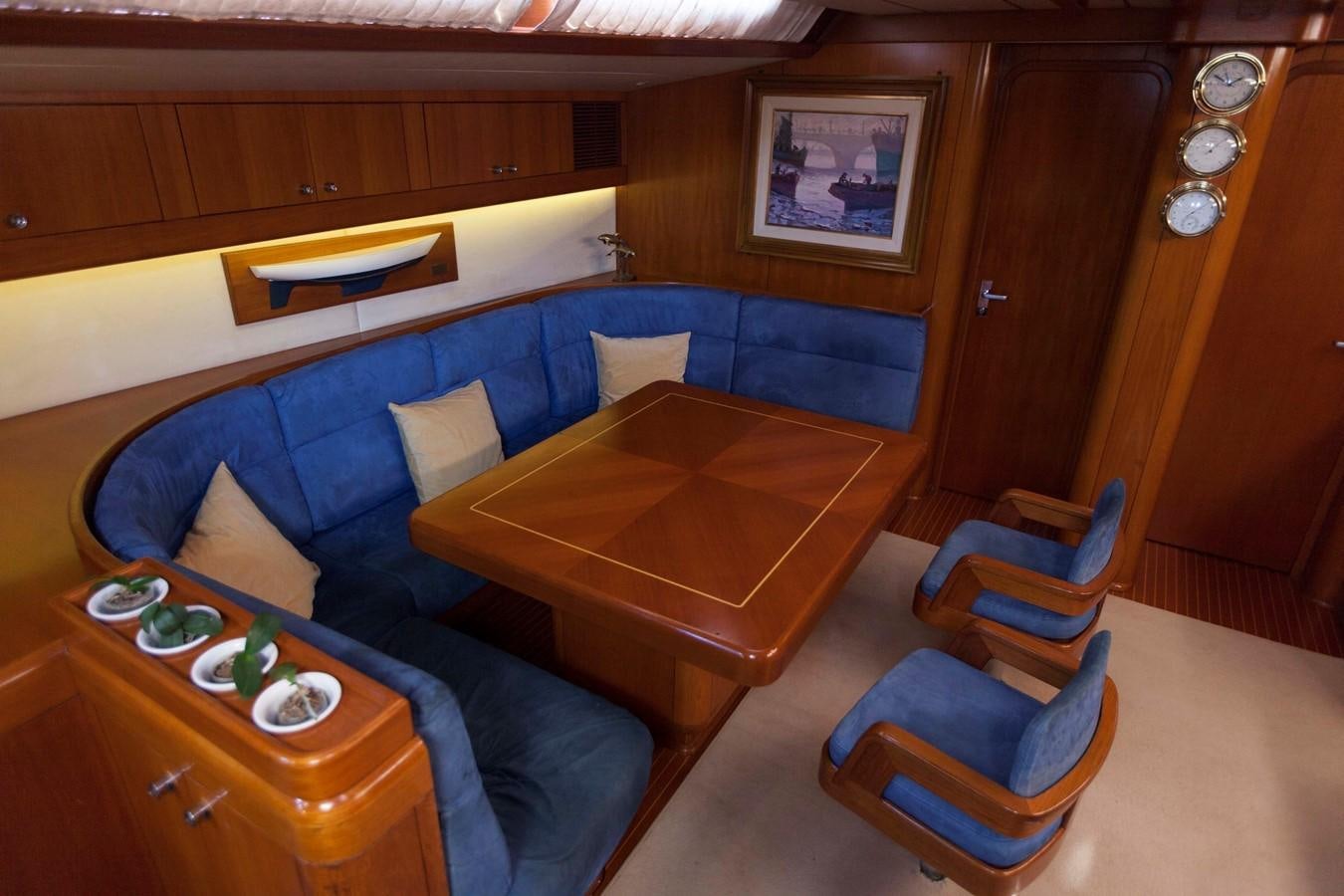 a room with a couch and a table aboard DREAMLAND Yacht for Sale