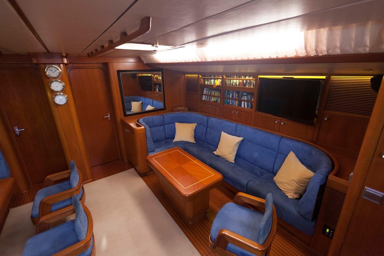 a room with a couch and a table aboard DREAMLAND Yacht for Sale