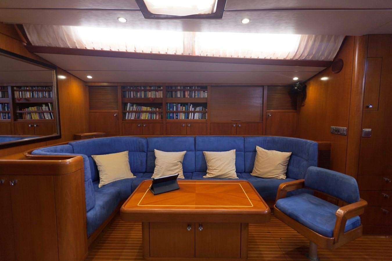 a room with a couch and a table aboard DREAMLAND Yacht for Sale