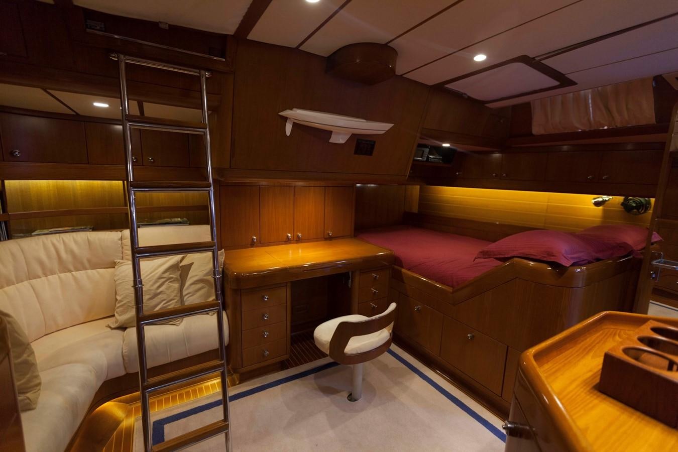 a bunk bed with a desk and a chair aboard DREAMLAND Yacht for Sale