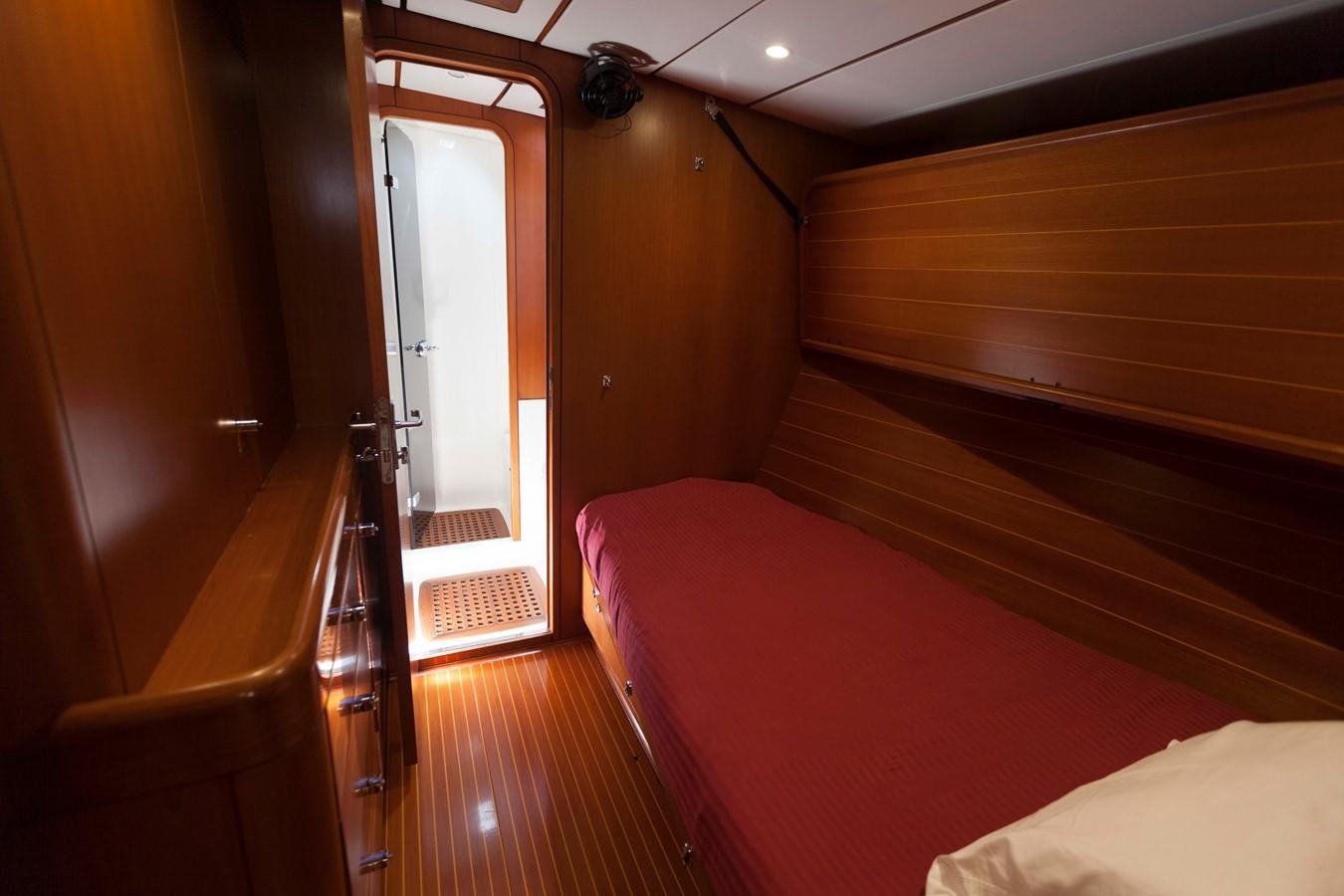 a room with a bed and a window aboard DREAMLAND Yacht for Sale