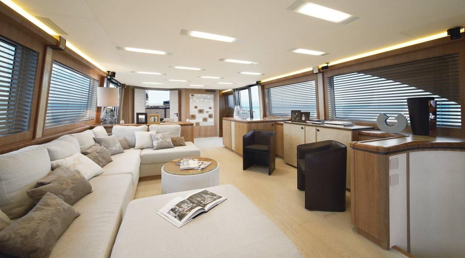 a living room with a couch and a table aboard MONTE CARLO YACHTS MCY 86 Yacht for Sale