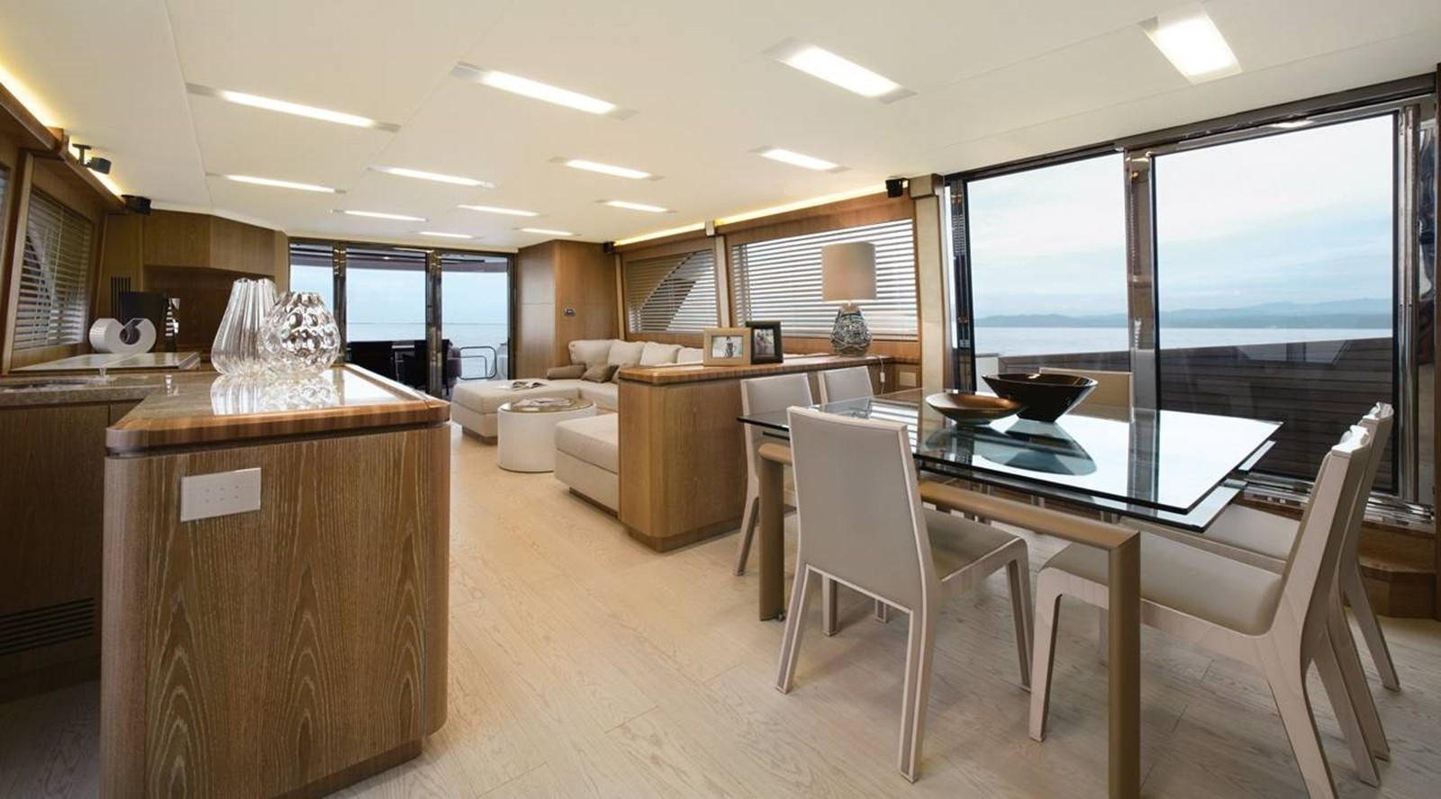 a kitchen and living room aboard MONTE CARLO YACHTS MCY 86 Yacht for Sale