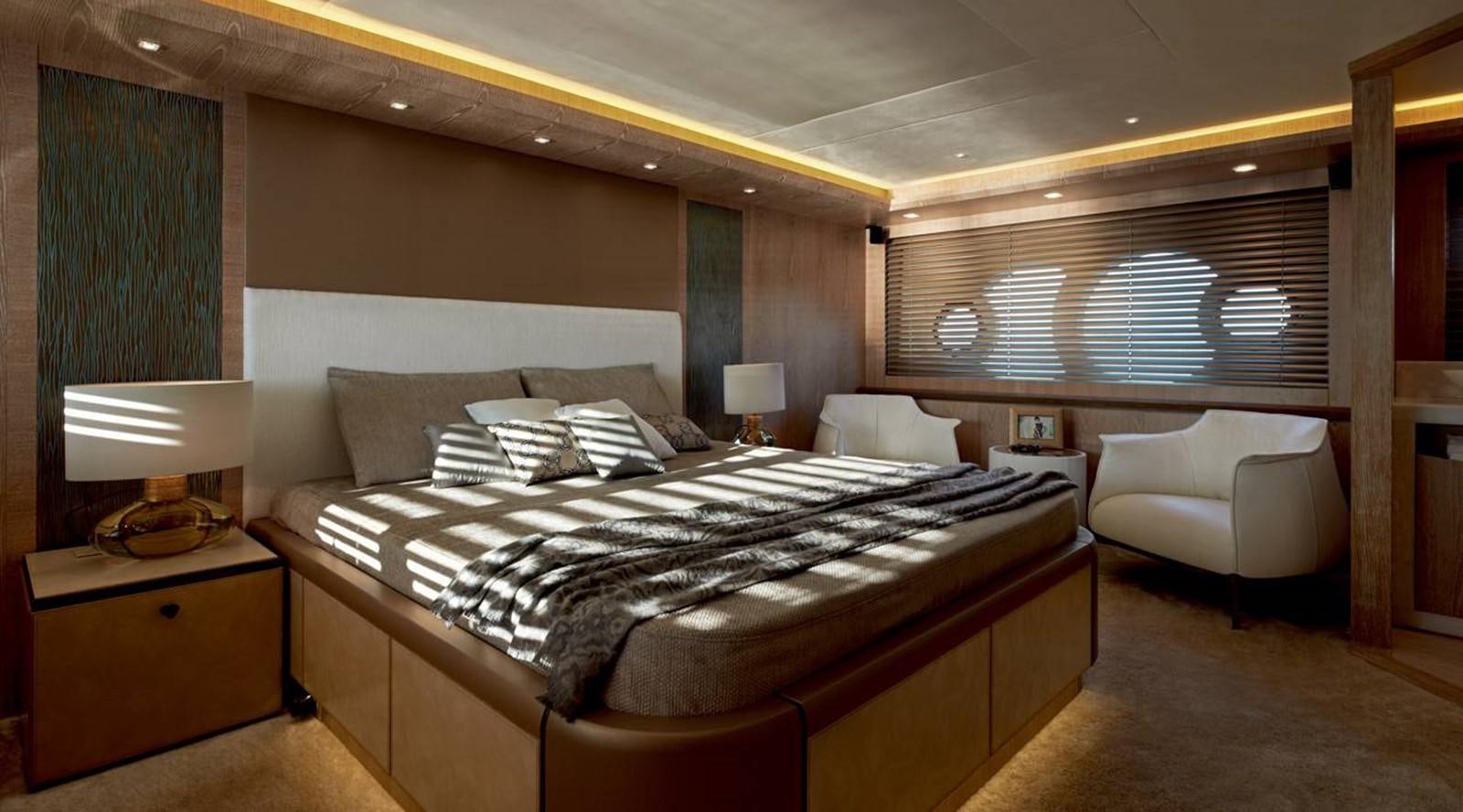 a large bedroom with a bed and a chair aboard MONTE CARLO YACHTS MCY 86 Yacht for Sale