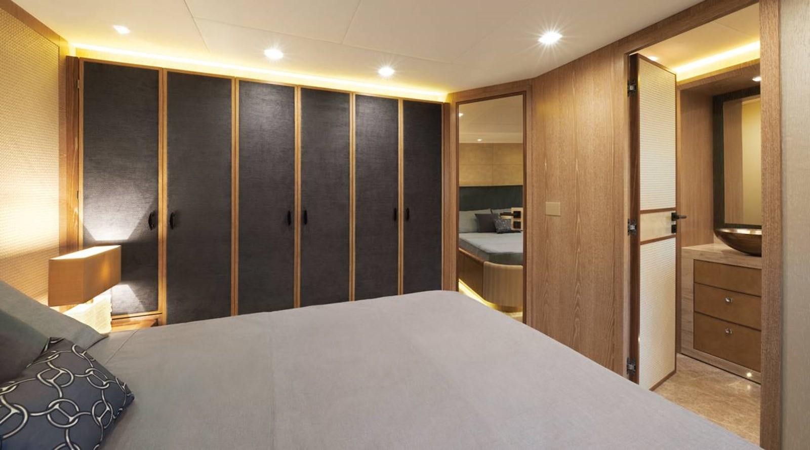 a large bathroom with a large mirror aboard MONTE CARLO YACHTS MCY 86 Yacht for Sale