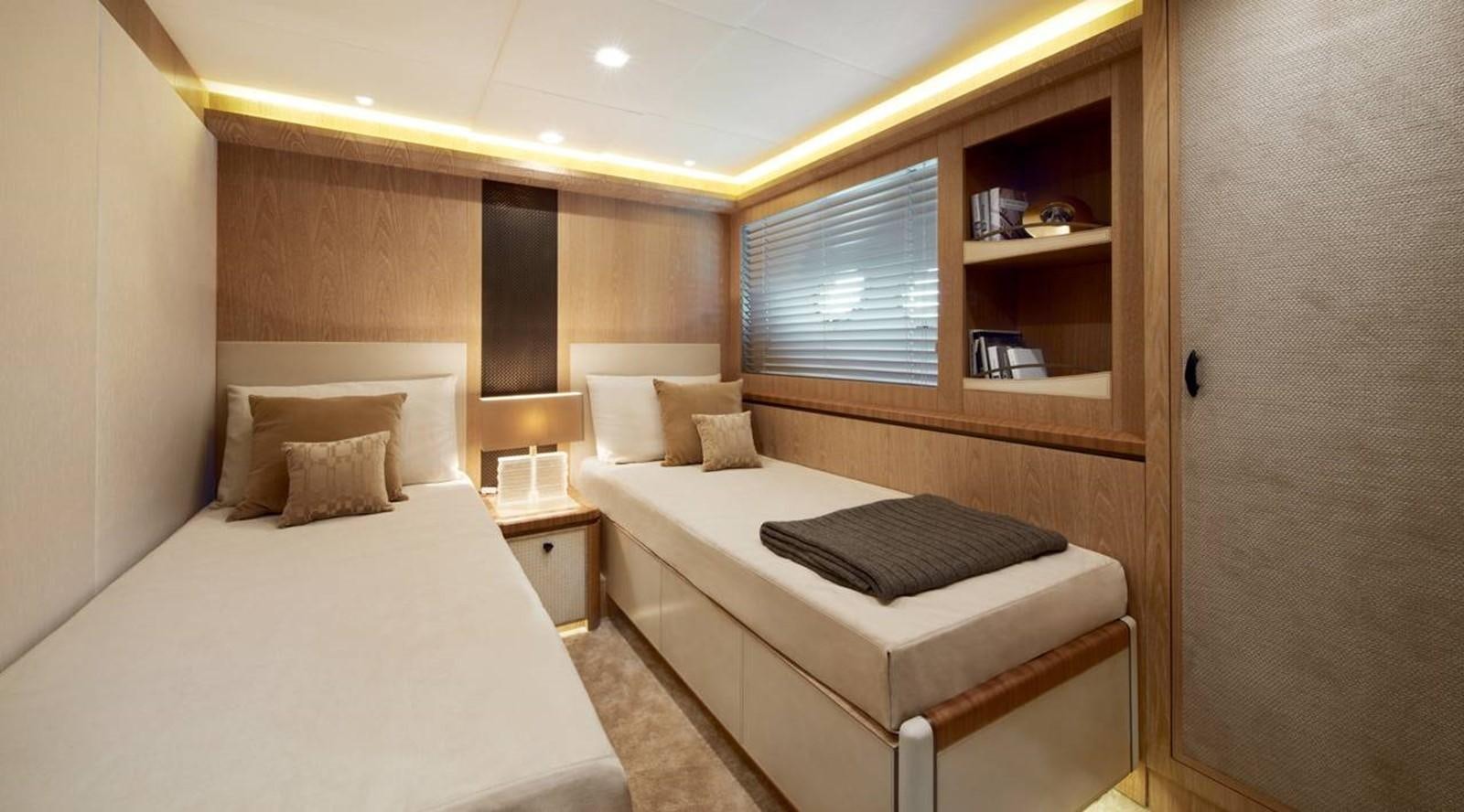 a room with two beds aboard MONTE CARLO YACHTS MCY 86 Yacht for Sale