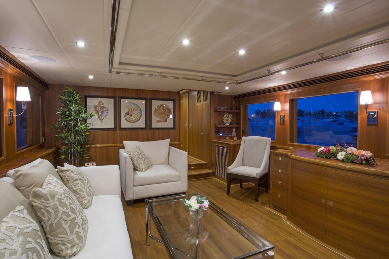 a living room with a large screen aboard 860 DBMY Yacht for Sale