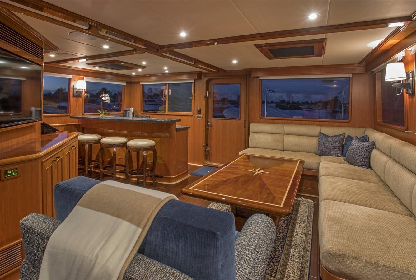 a living room with couches and a table aboard 860 DBMY Yacht for Sale