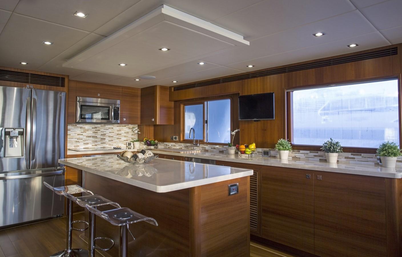 a kitchen with a large island aboard 860 DBMY Yacht for Sale