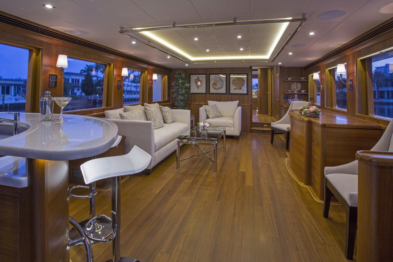 a living room with a wood floor aboard 860 DBMY Yacht for Sale
