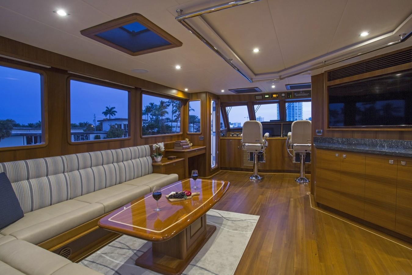 a living room with a couch and a table aboard 860 DBMY Yacht for Sale