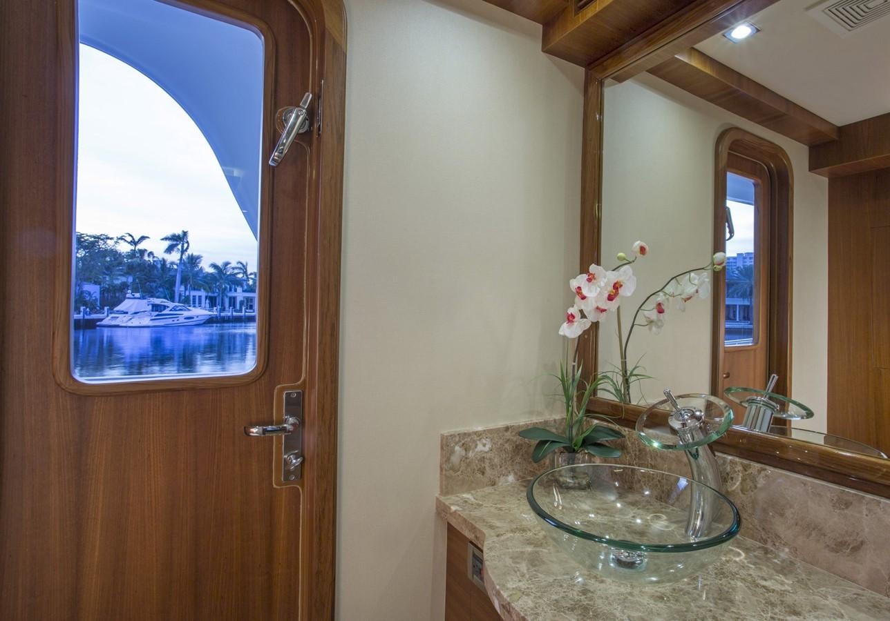 a vase with flowers on a counter aboard 860 DBMY Yacht for Sale
