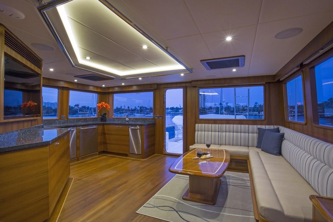 a living room with a couch and a table aboard 860 DBMY Yacht for Sale