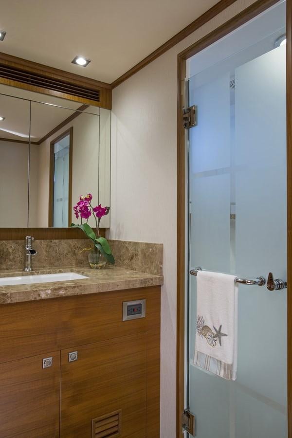 a bathroom with a glass shower aboard 860 DBMY Yacht for Sale