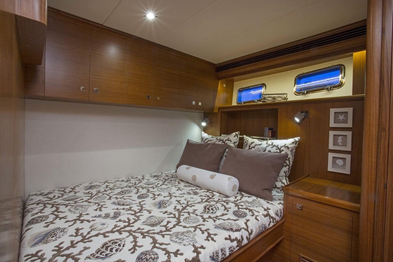 a bed with a white comforter aboard 860 DBMY Yacht for Sale