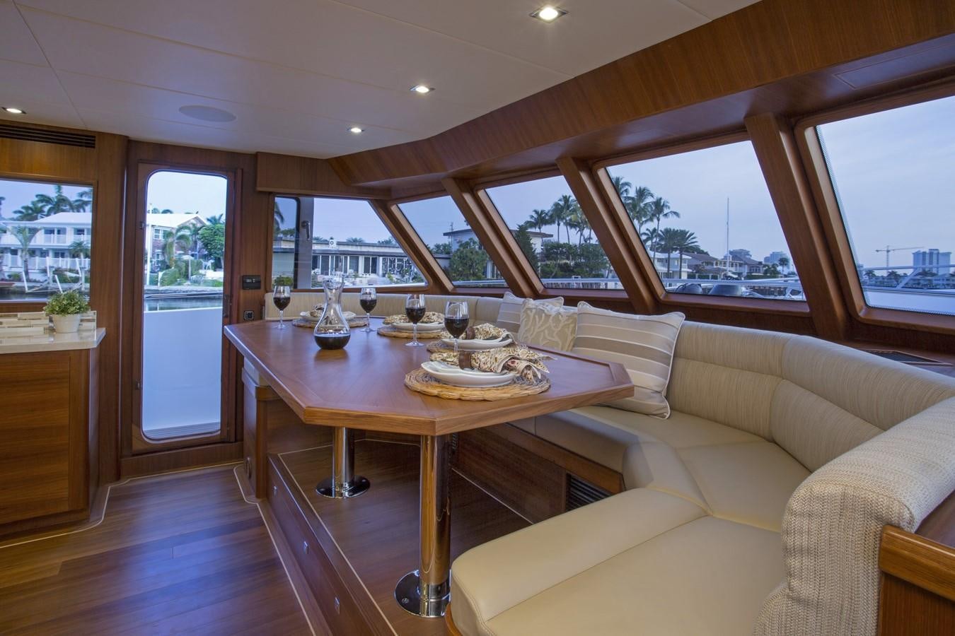 a dining table in a living room aboard 860 DBMY Yacht for Sale