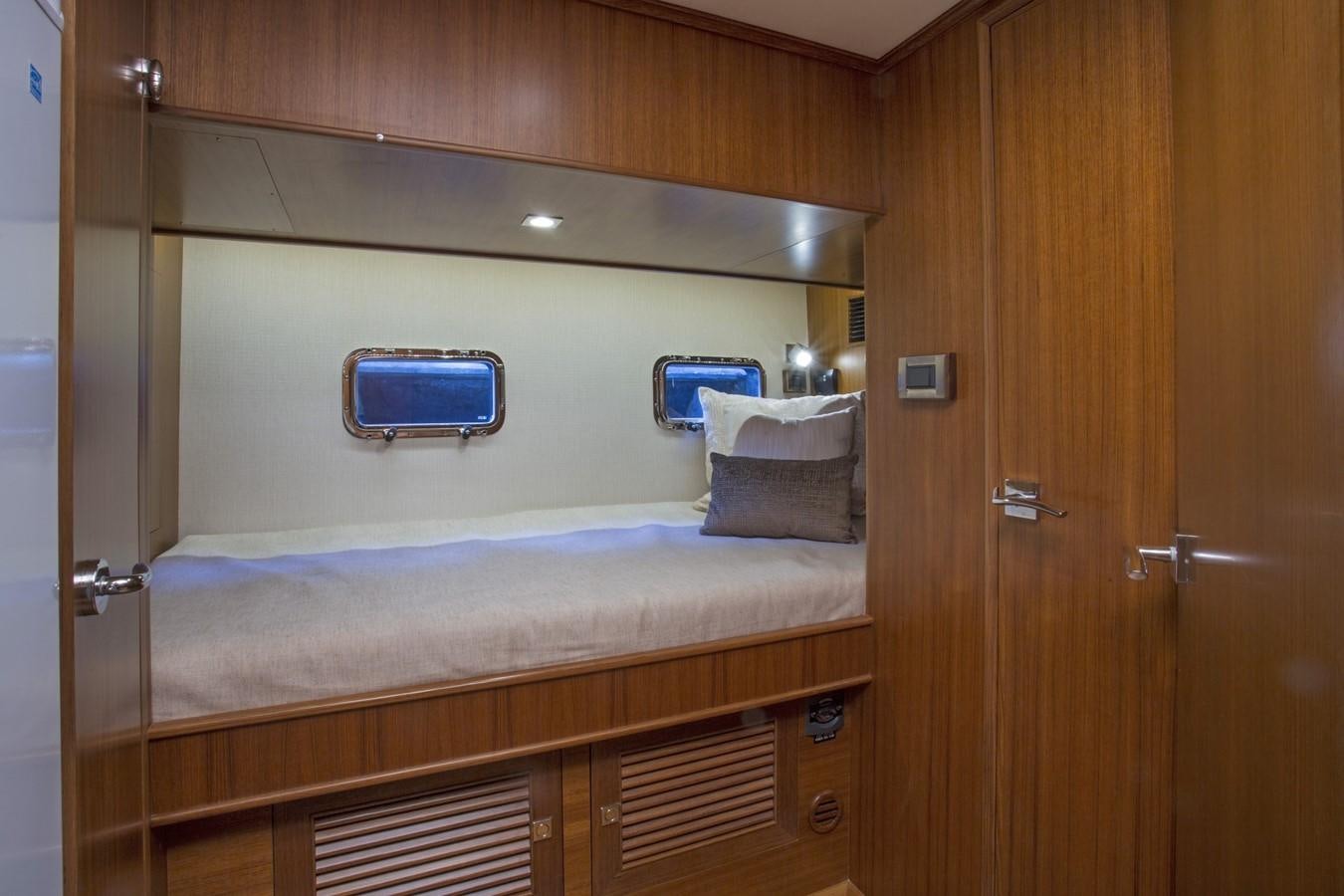 a room with a bed and a closet aboard 860 DBMY Yacht for Sale