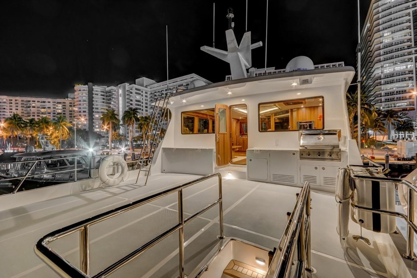 a deck with a view of a city and a large building aboard 860 DBMY Yacht for Sale