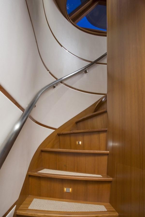 a wooden staircase with a glass window aboard 860 DBMY Yacht for Sale