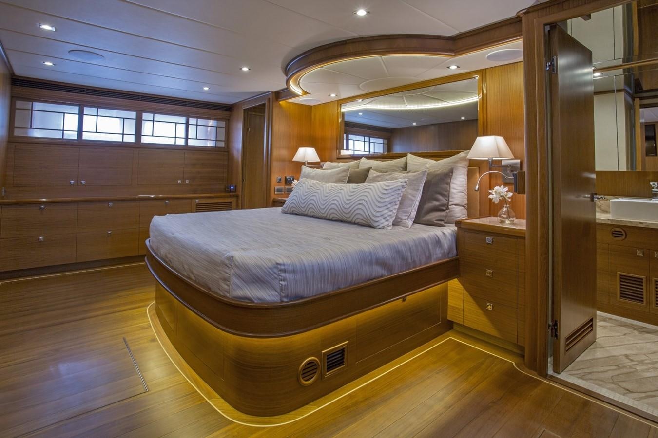 a large bedroom with a large bed aboard 860 DBMY Yacht for Sale