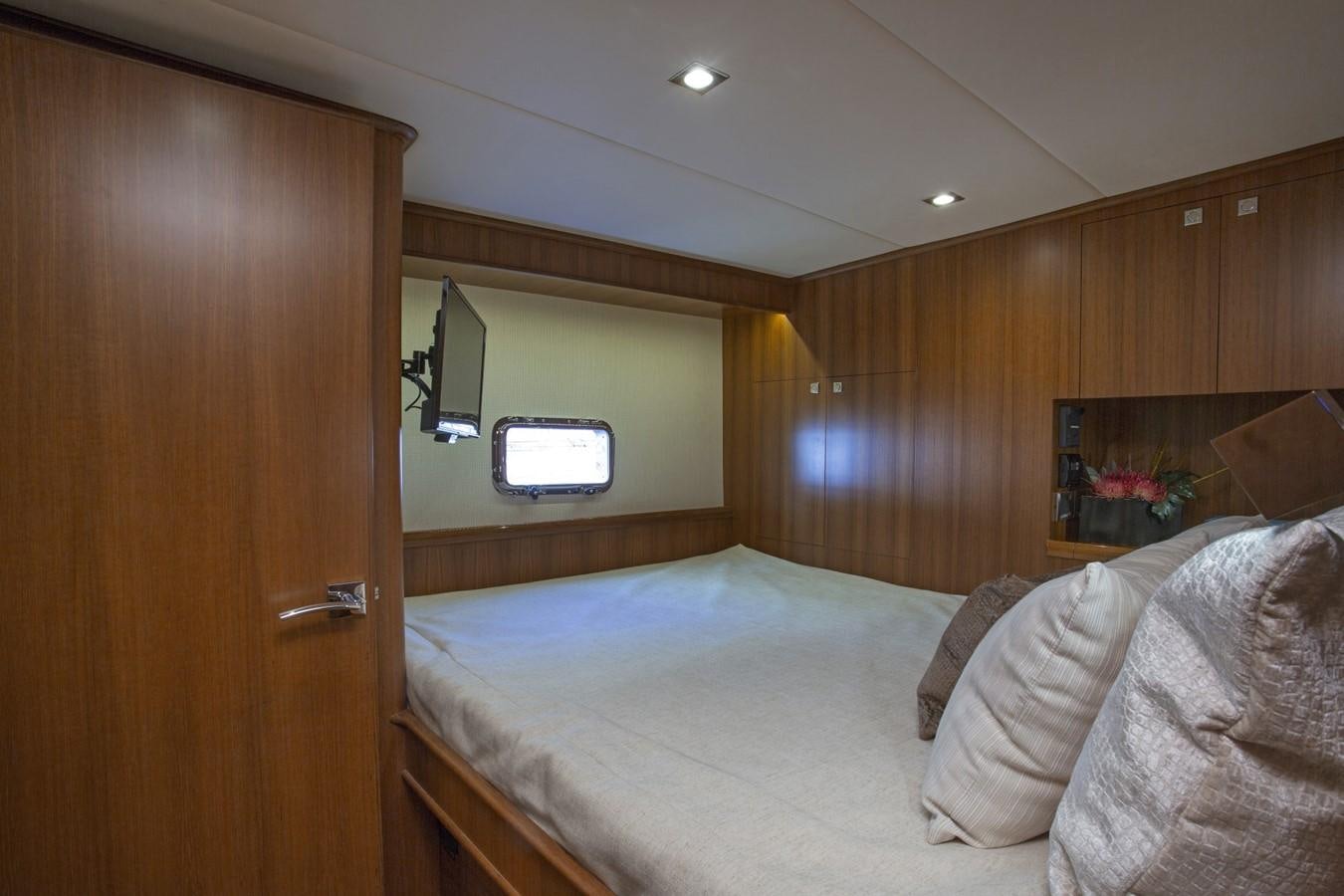 a bedroom with wood walls aboard 860 DBMY Yacht for Sale