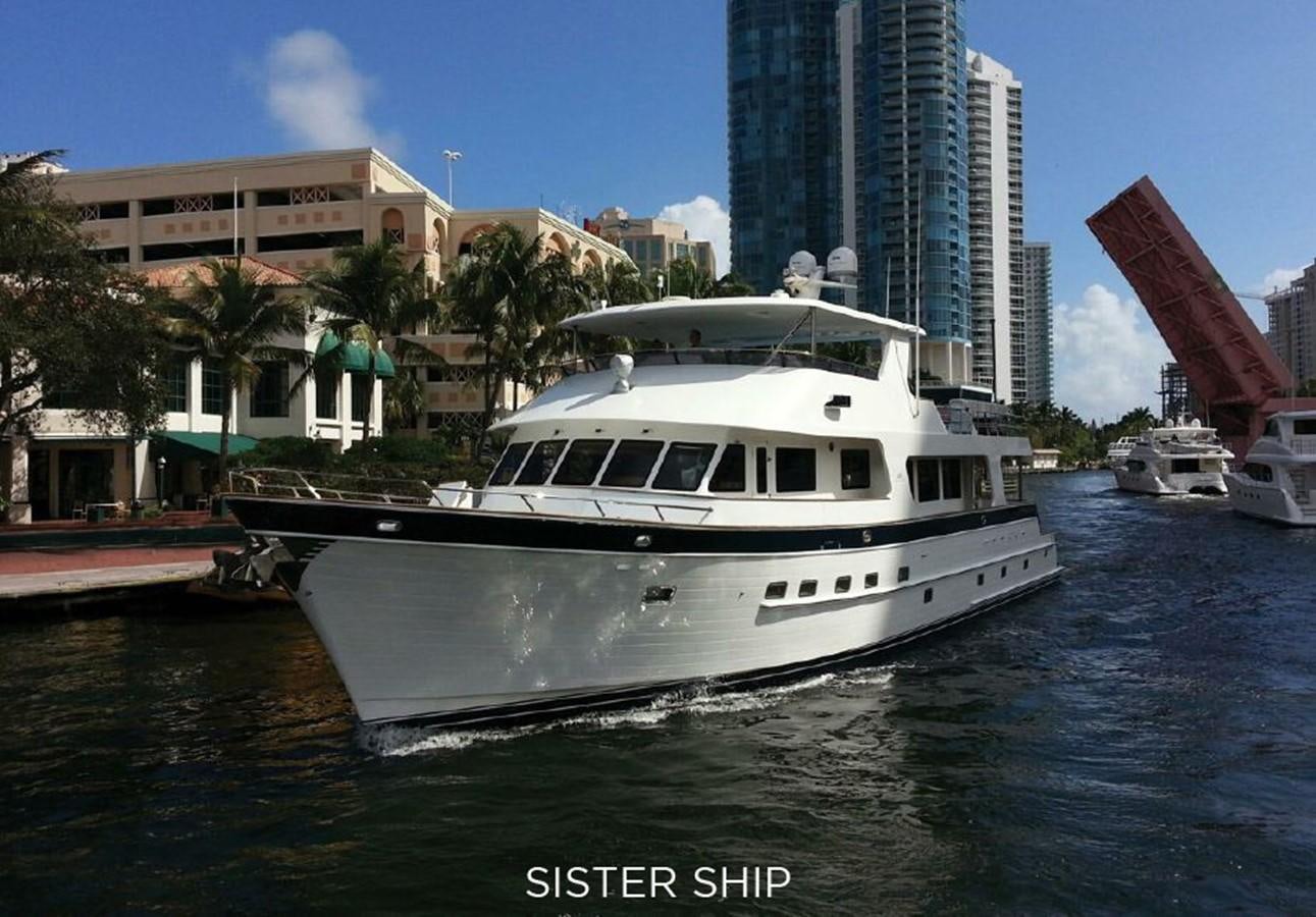 a white boat in a harbor aboard 860 MY Yacht for Sale