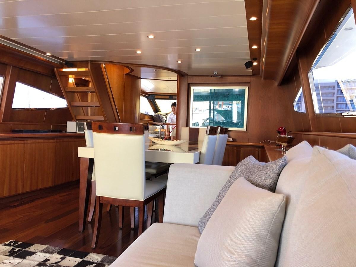 a room with a couch and a table aboard CATARI Yacht for Sale