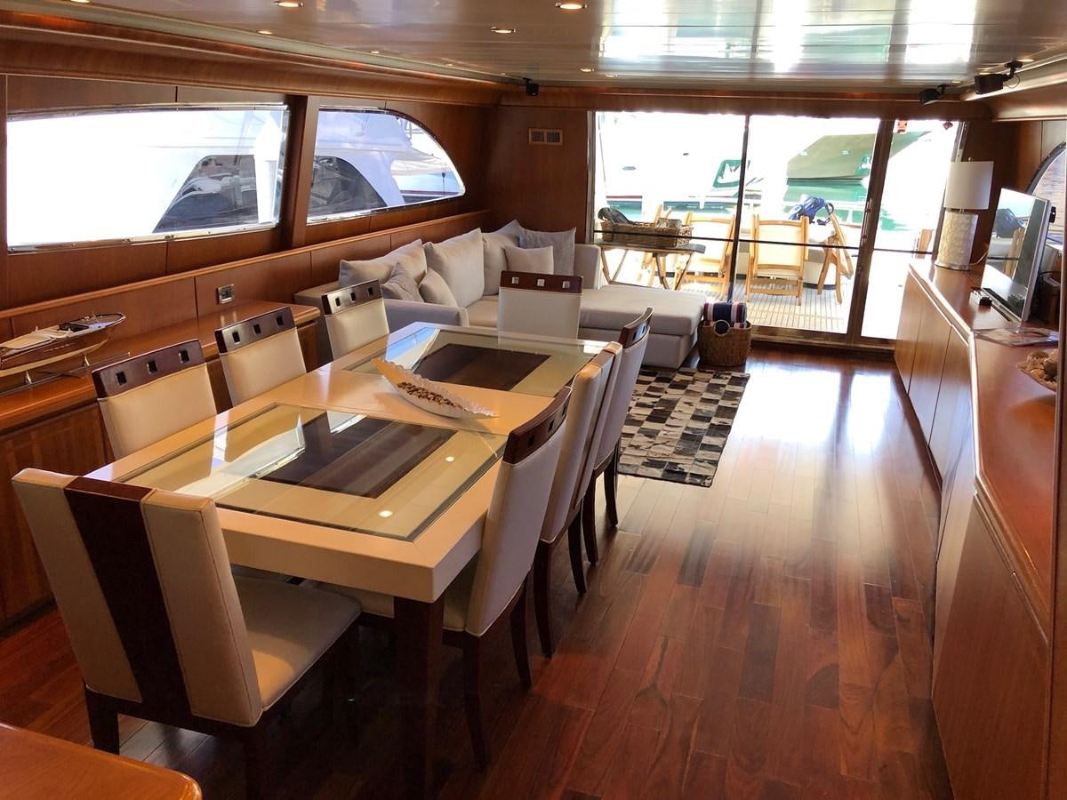 a room with a table and chairs aboard CATARI Yacht for Sale