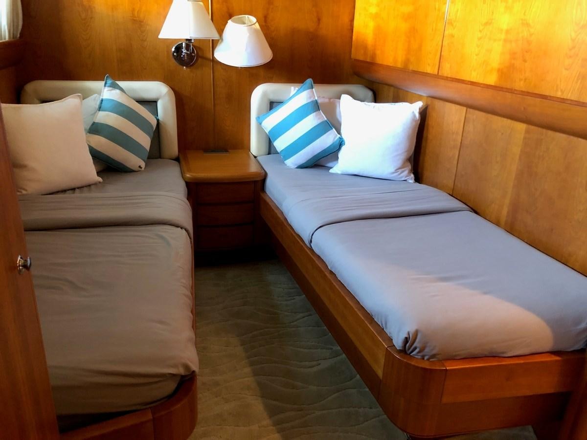 a couple of beds in a hotel room aboard CATARI Yacht for Sale