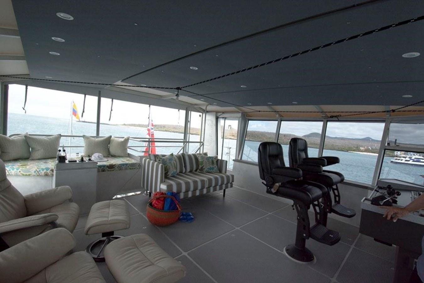 a large room with a couch and a table aboard IRON LADY II Yacht for Sale