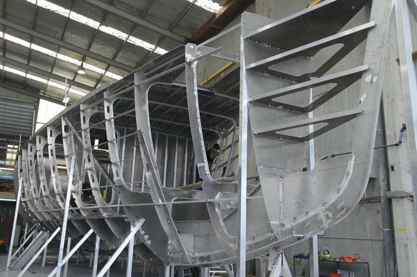 a person working on a large machine aboard IRON LADY II Yacht for Sale