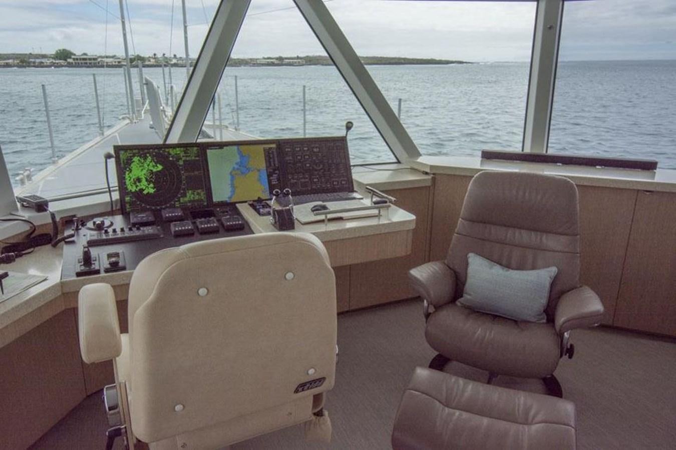a boat with a desk and a chair and a laptop on it aboard IRON LADY II Yacht for Sale