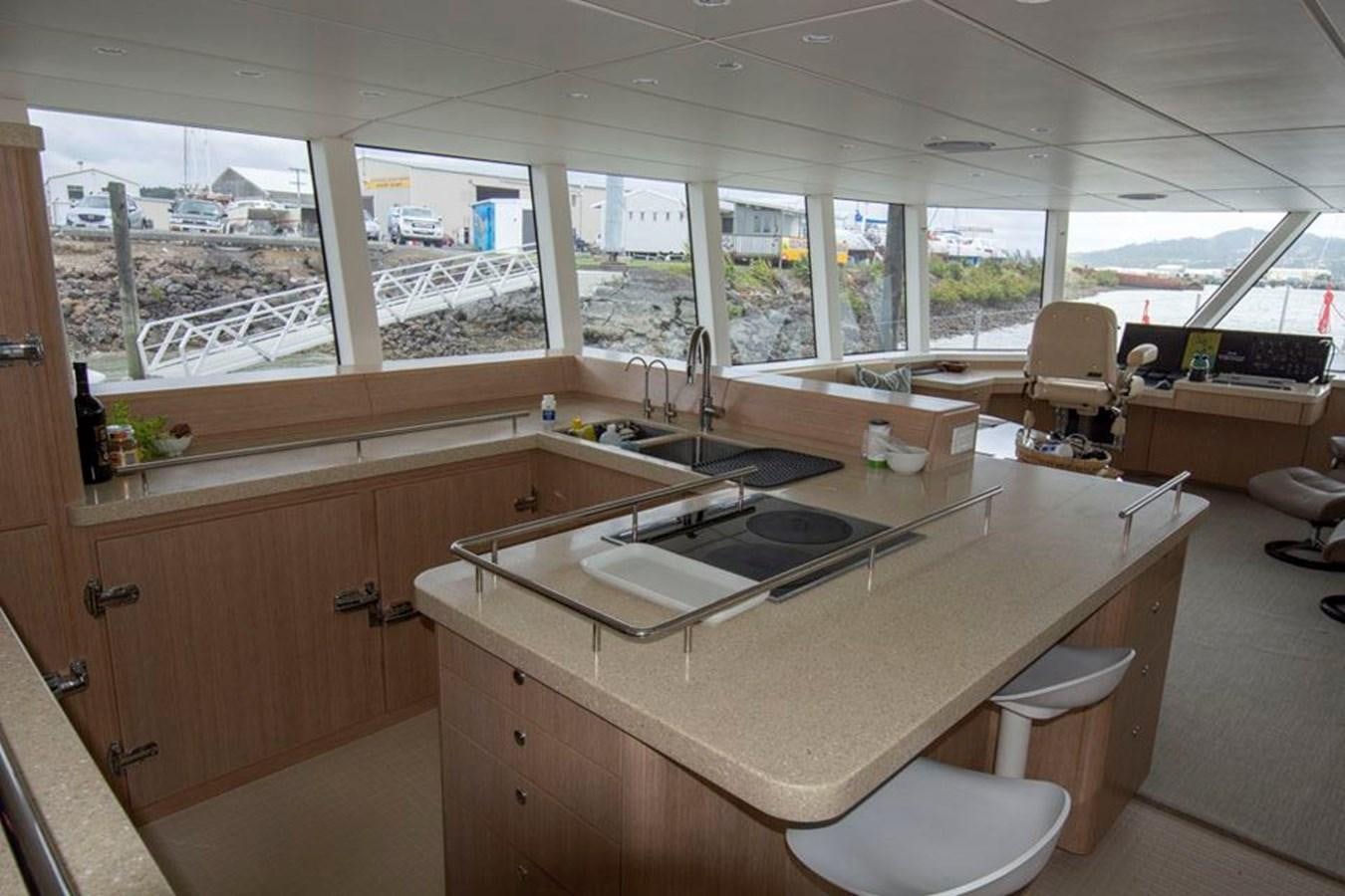 a room with a large window and a large open window aboard IRON LADY II Yacht for Sale