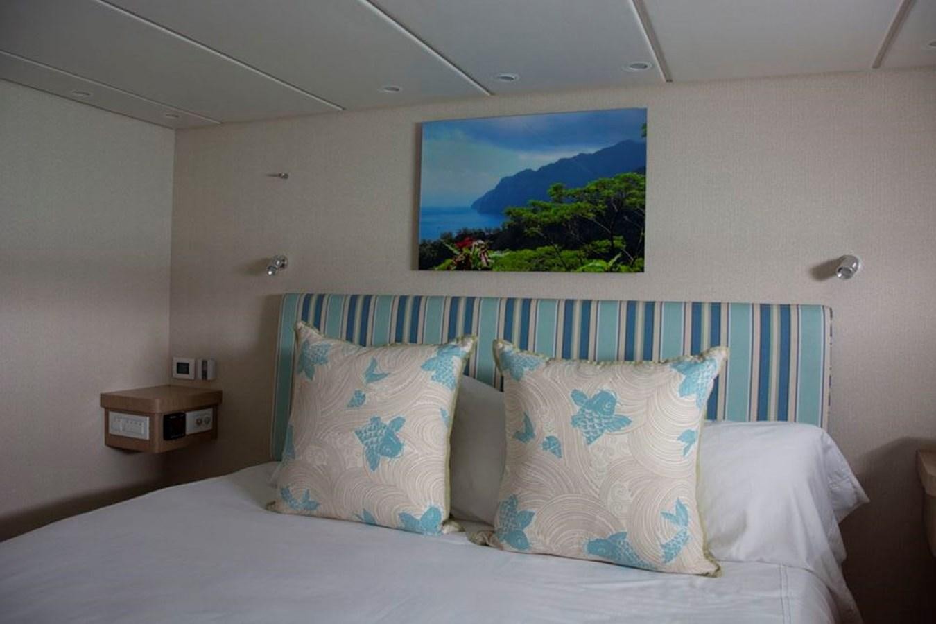 a bed with pillows aboard IRON LADY II Yacht for Sale