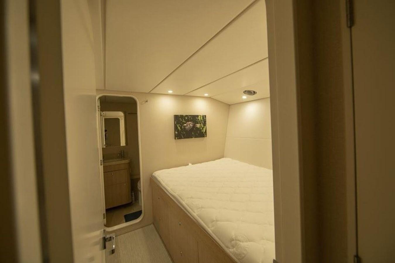 a bathroom with a bed aboard IRON LADY II Yacht for Sale