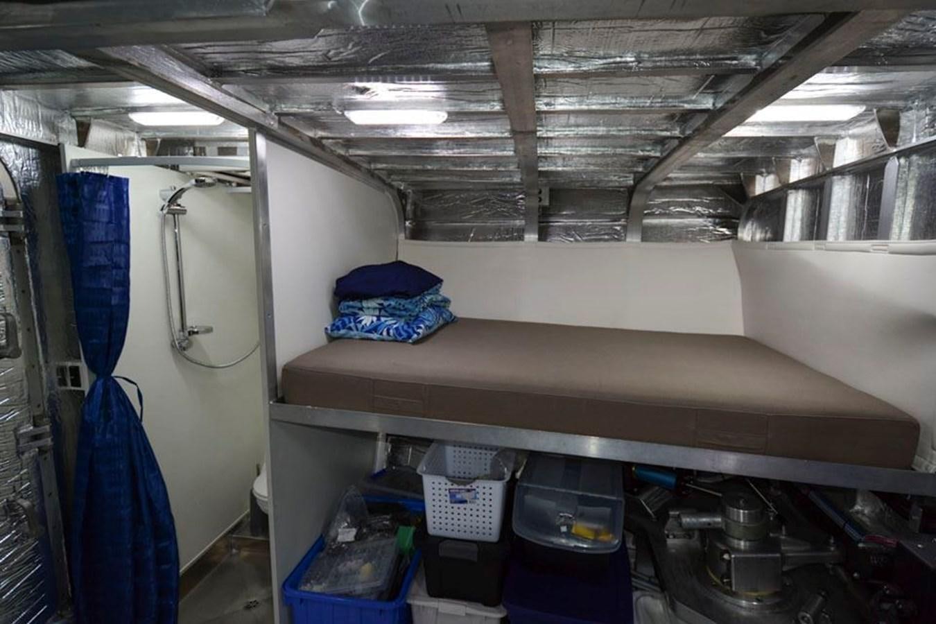 a room with a blue bag on the shelf aboard IRON LADY II Yacht for Sale