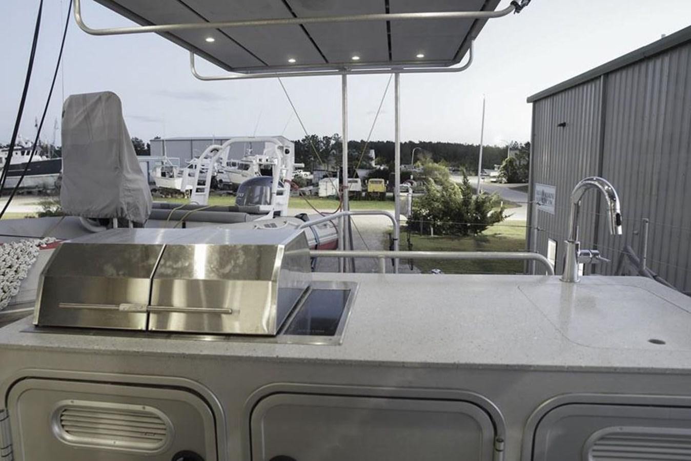 a car with a large tank aboard IRON LADY II Yacht for Sale