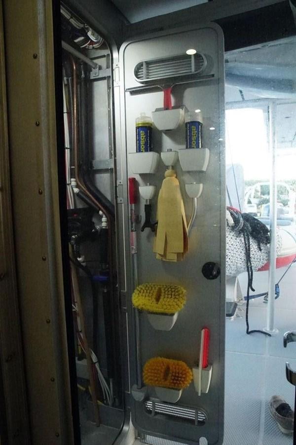 a door with a bunch of items on it aboard IRON LADY II Yacht for Sale