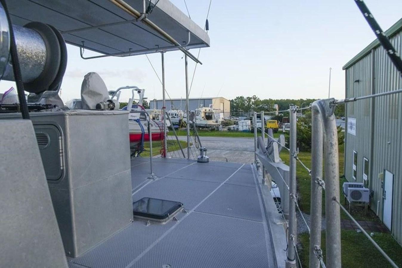 a view of a parking lot from a balcony aboard IRON LADY II Yacht for Sale