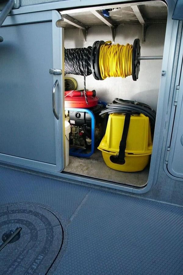 a yellow suitcase on a train aboard IRON LADY II Yacht for Sale
