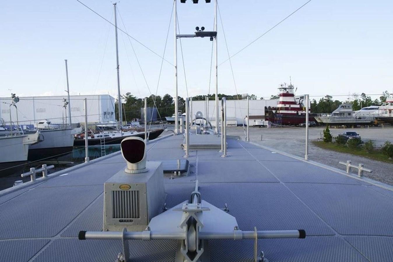 a marina with boats and a red and white boat aboard IRON LADY II Yacht for Sale