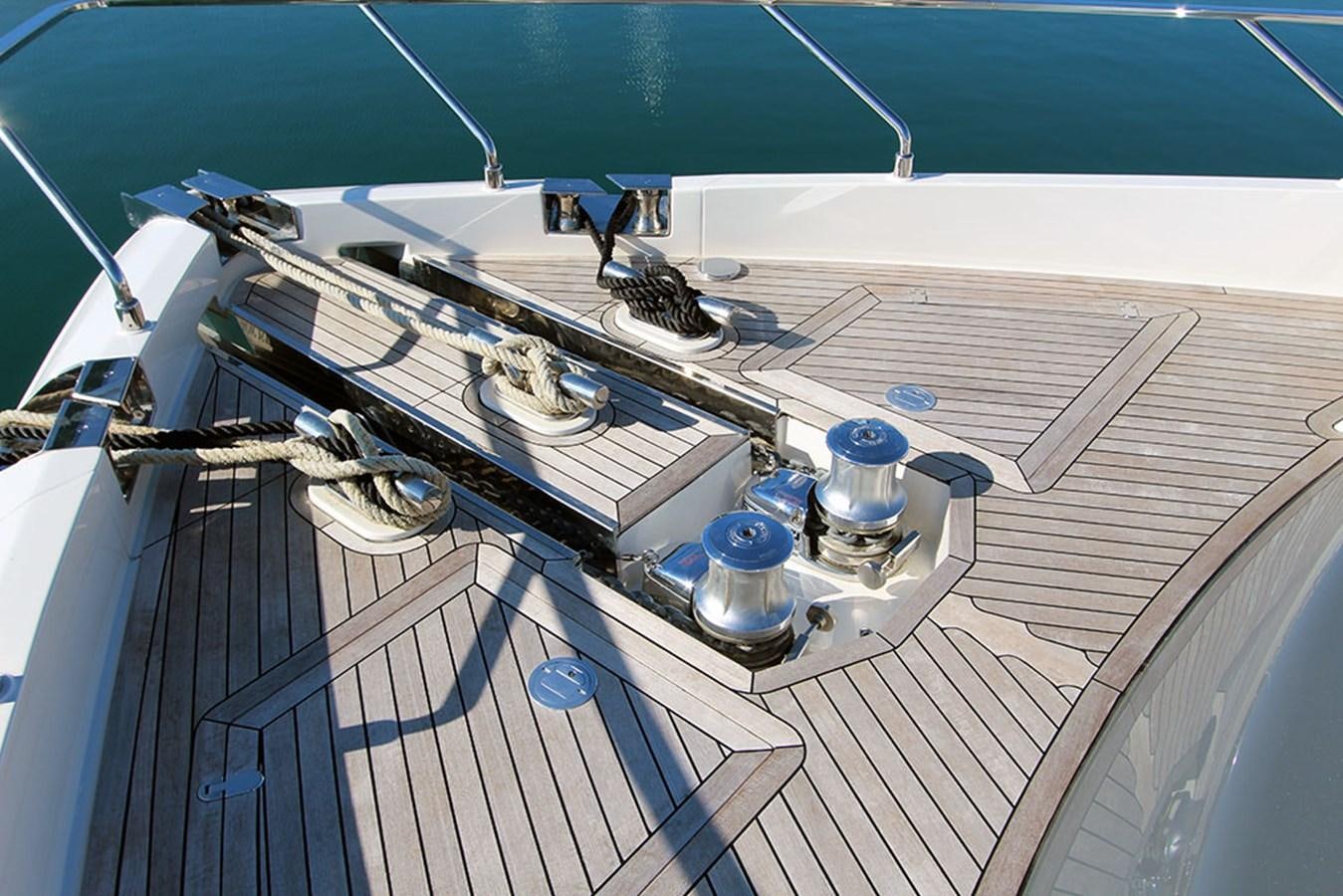 a large white ship on a deck aboard ANASSA A Yacht for Sale