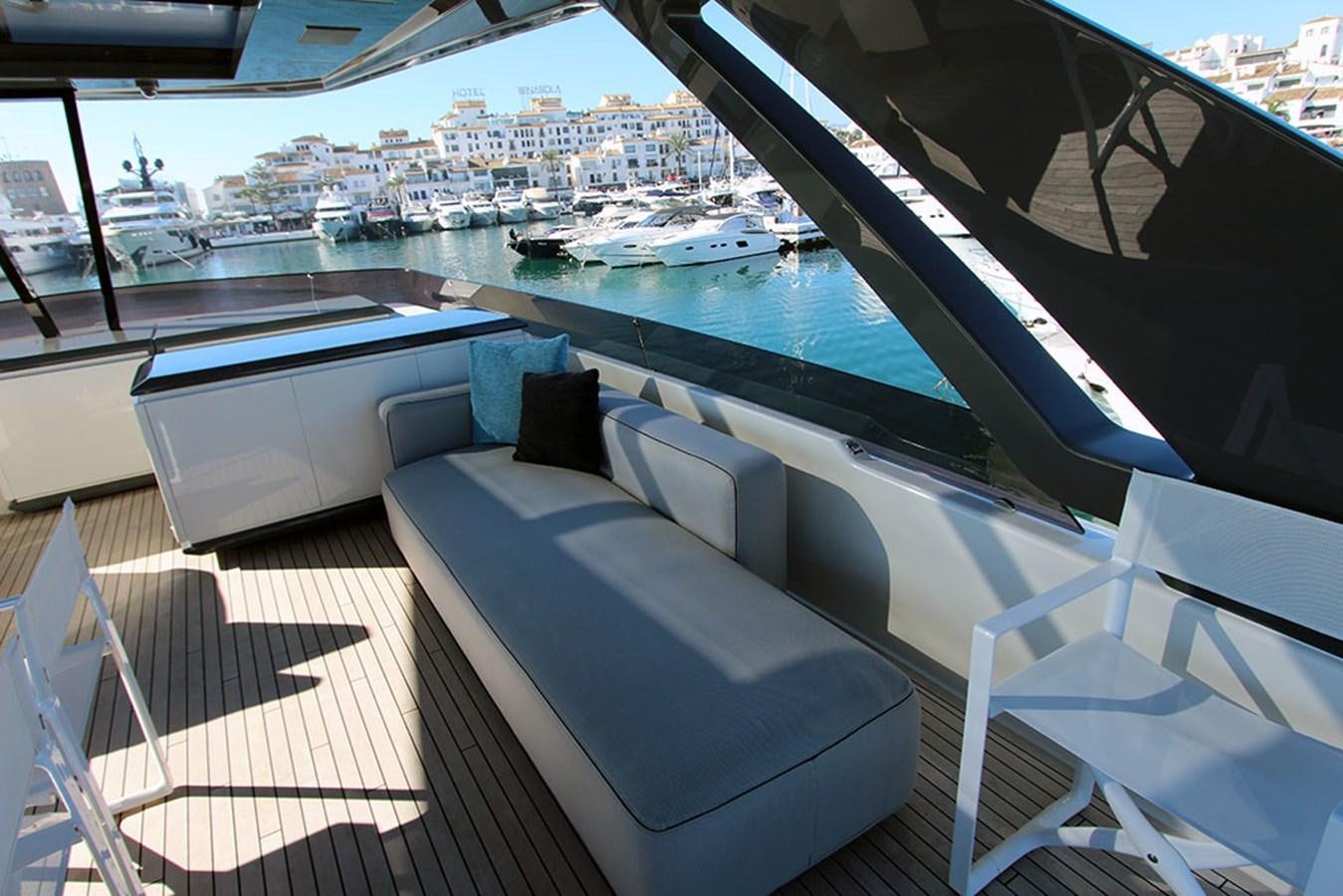 a deck with a view of a city and water aboard ANASSA A Yacht for Sale