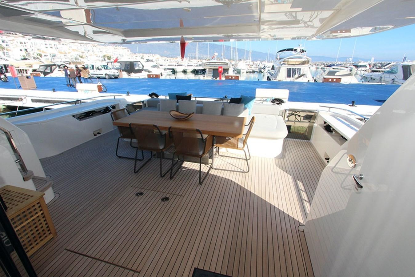 a boat with tables and chairs aboard ANASSA A Yacht for Sale