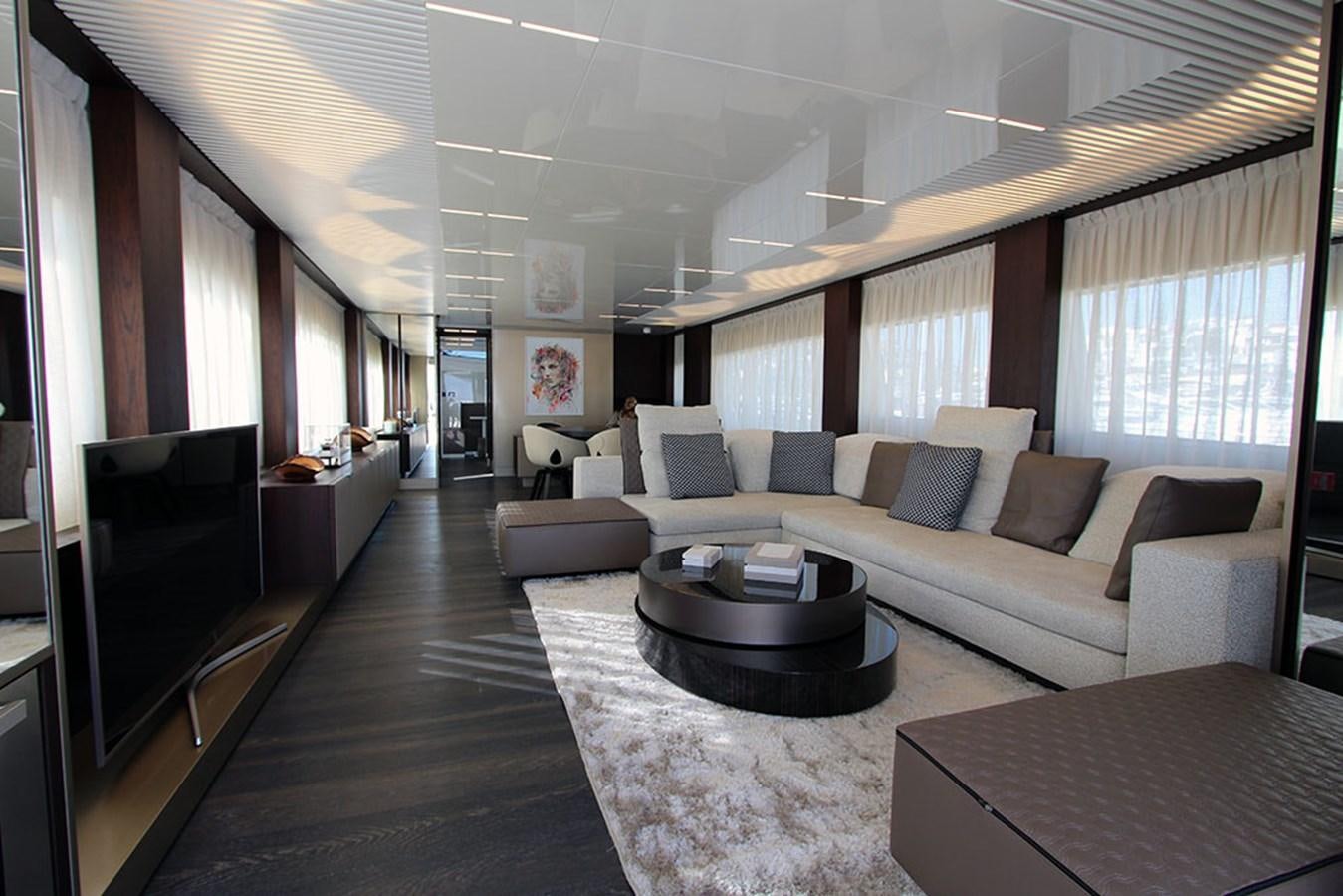 a living room with a large window aboard ANASSA A Yacht for Sale