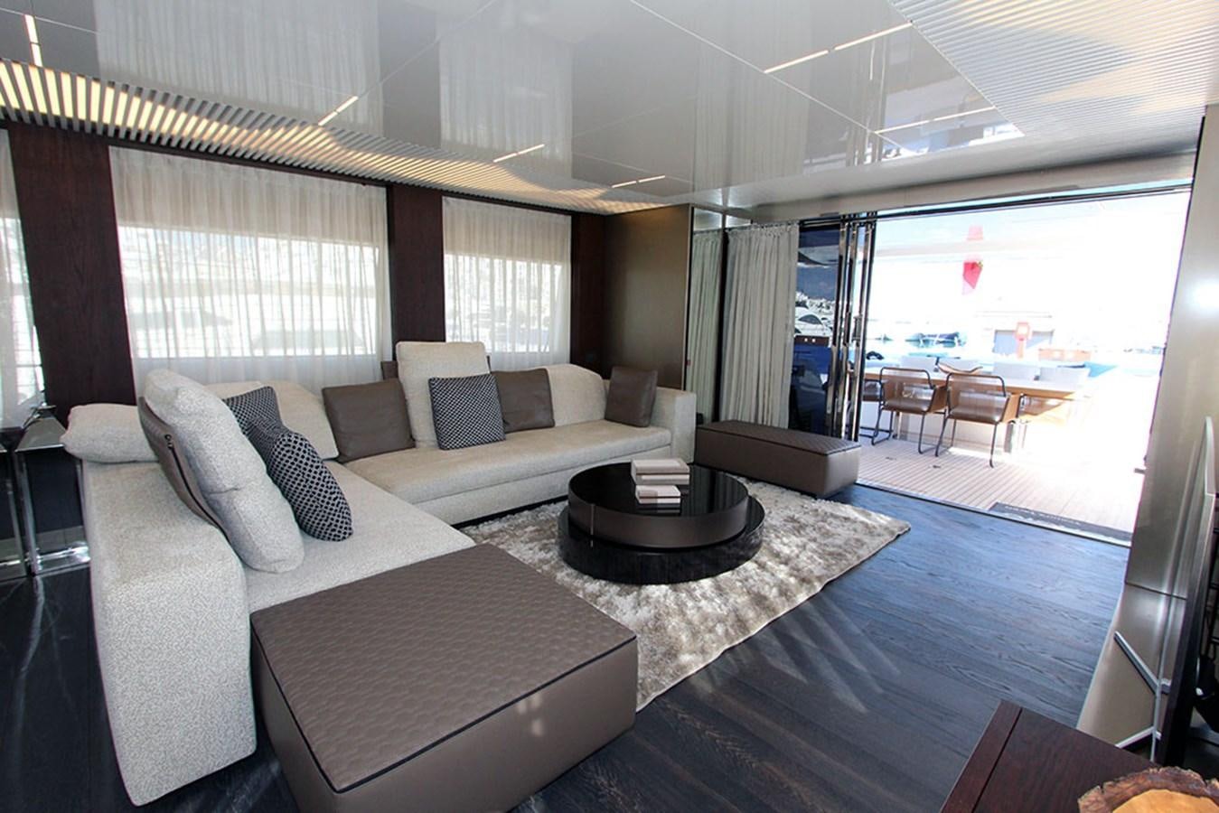 a room with a couch and a table aboard ANASSA A Yacht for Sale