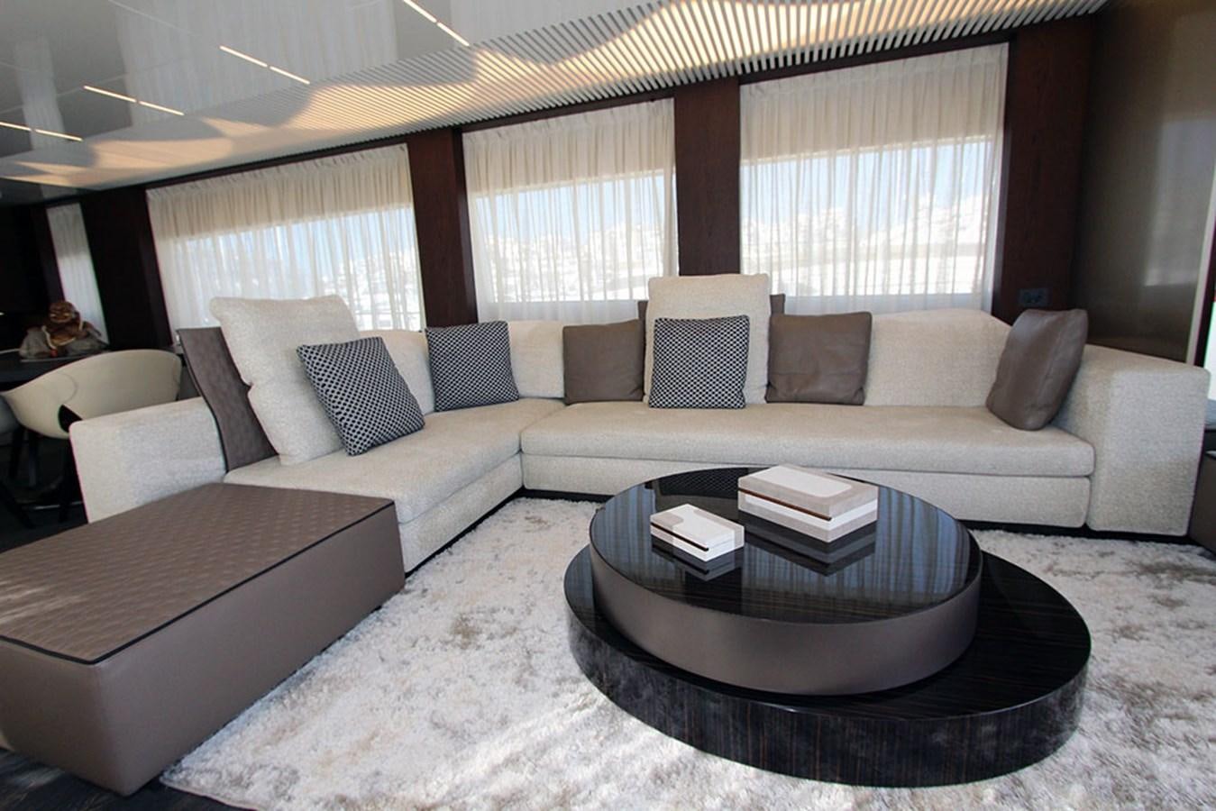 a living room with a couch and a coffee table aboard ANASSA A Yacht for Sale
