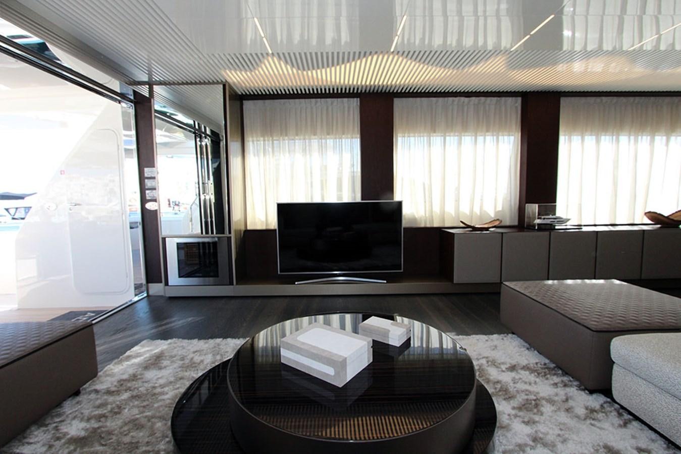 a living room with a large television aboard ANASSA A Yacht for Sale
