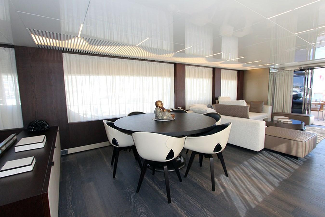 a large room with a table and chairs aboard ANASSA A Yacht for Sale