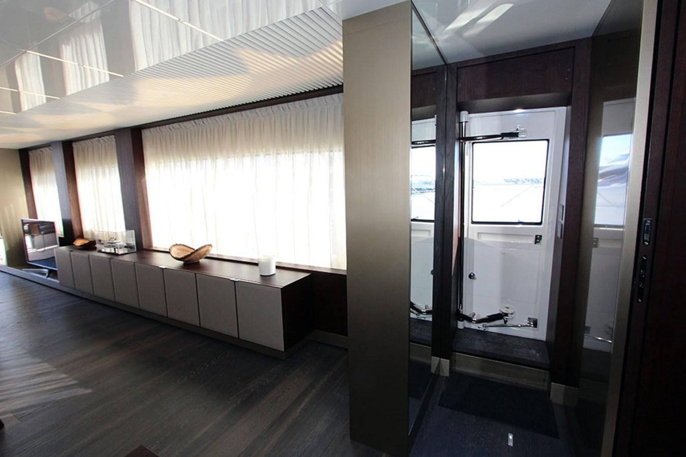 a room with a bed and a desk aboard ANASSA A Yacht for Sale
